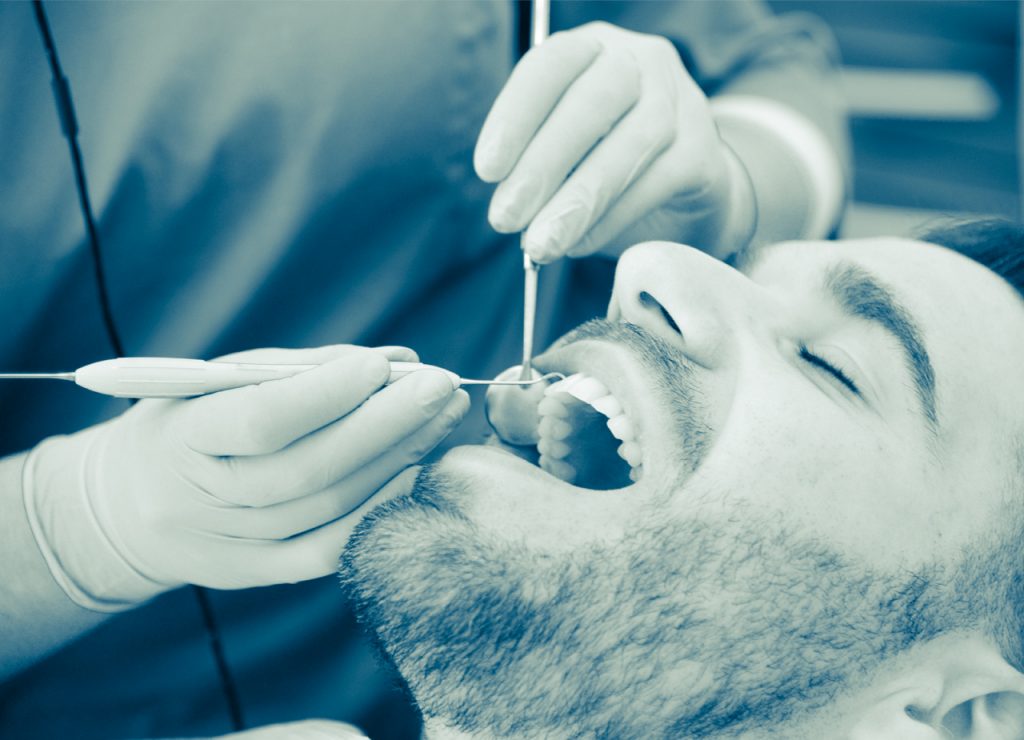 man getting dental examination